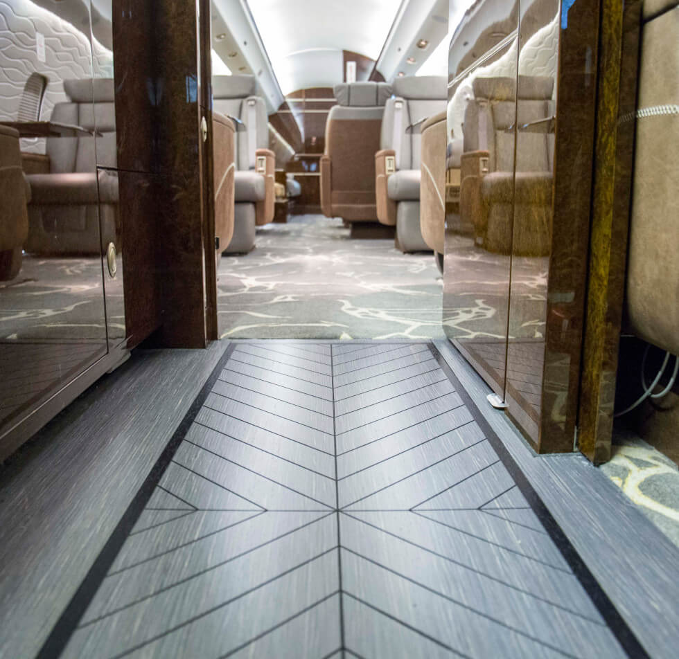 Gray veneer "hardwood" floor installed by Constant Aviation in the galley of a "Boardroom" themed Global Express.