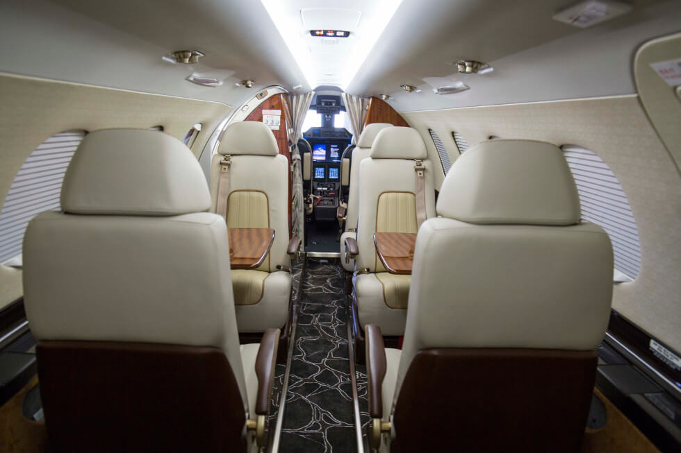 Forward facing view of the cabin of a Phenom 300 aircraft following a complete interior refurbishment